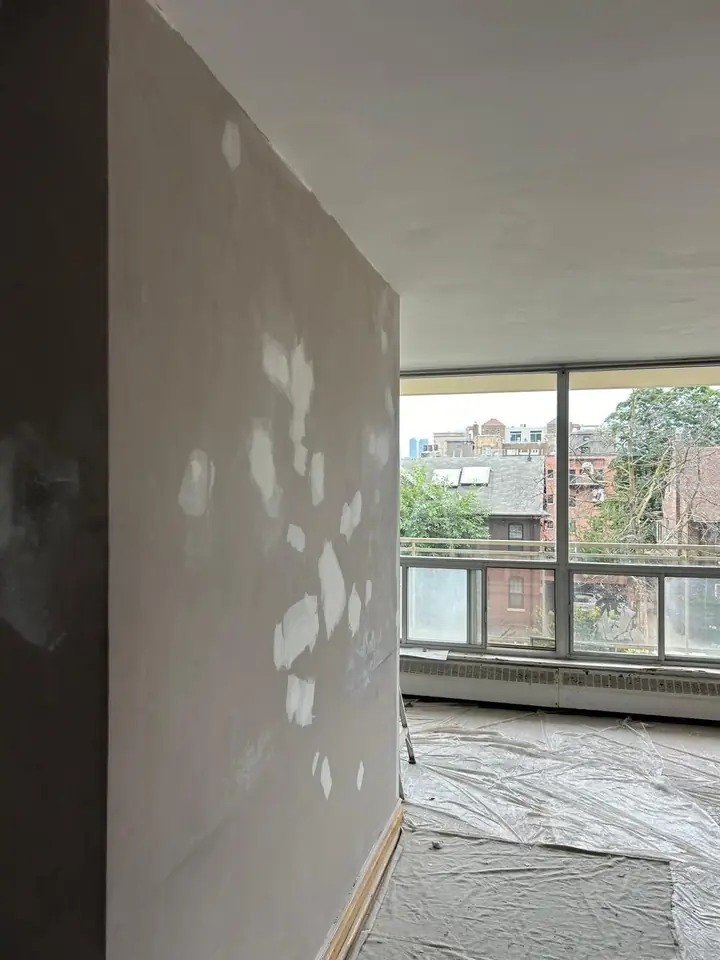 Plastering a wall before paint