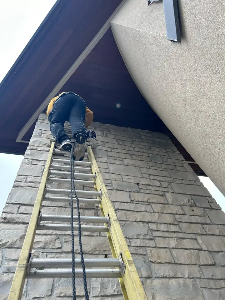 Working at height on the brick facade