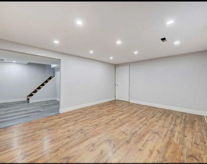 Finished basement with hardwood floors