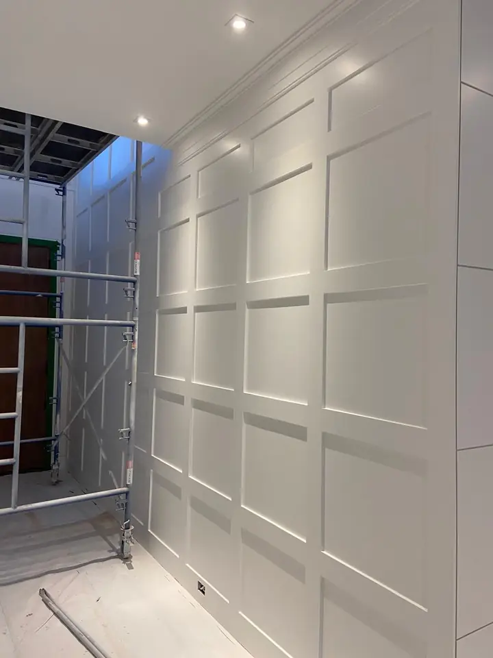 Tall wall prepped with scaffolding