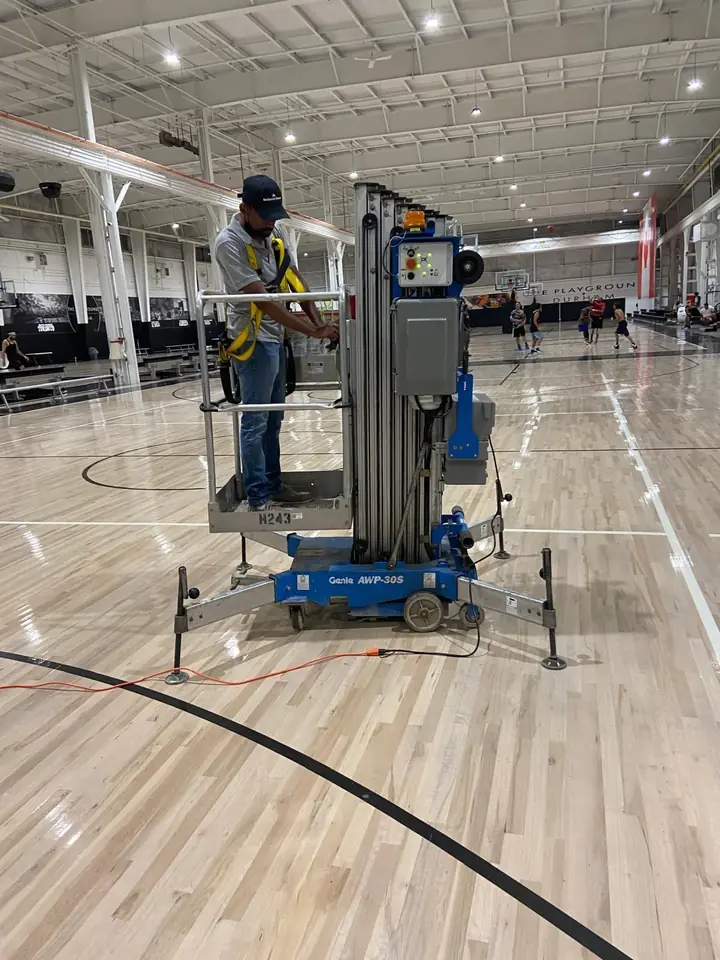 Lift work over the basketball court